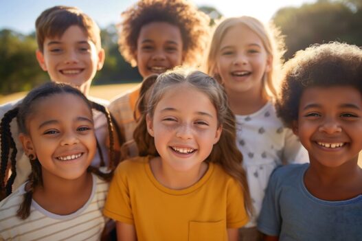 Portrait Of Multi-Cultural Children Hanging Out With Friends In The Countryside Together